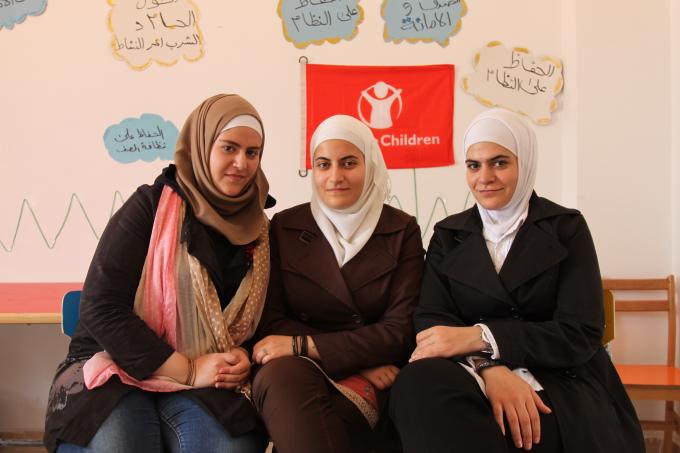 (L-R) Syrian sisters Fatma, Banan and Media Al Safady at Save the Children’s Child Friendly Space in El-Obour, Greater Cairo, where they have helped facilitate children’s activities since November 2013. 