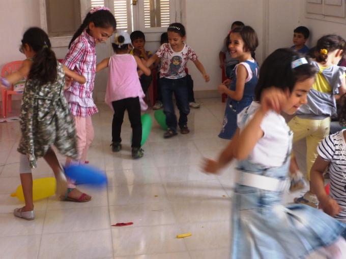 Syrian children, aged 6-7 years, during the first games session held in our newest Child Friendly Space in Greater Cairo 