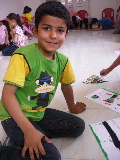 Shady*, aged 7, during his first day attending the Child Friendly Space. The children drew with colours and played balloon games, led by our energetic facilitators who will run sessions six days per week.